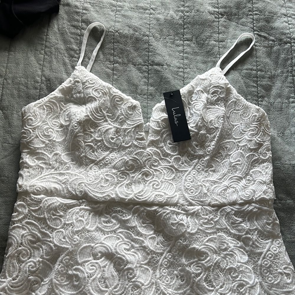 Lulus white dress with lace overlay. New with tags. Never worn.